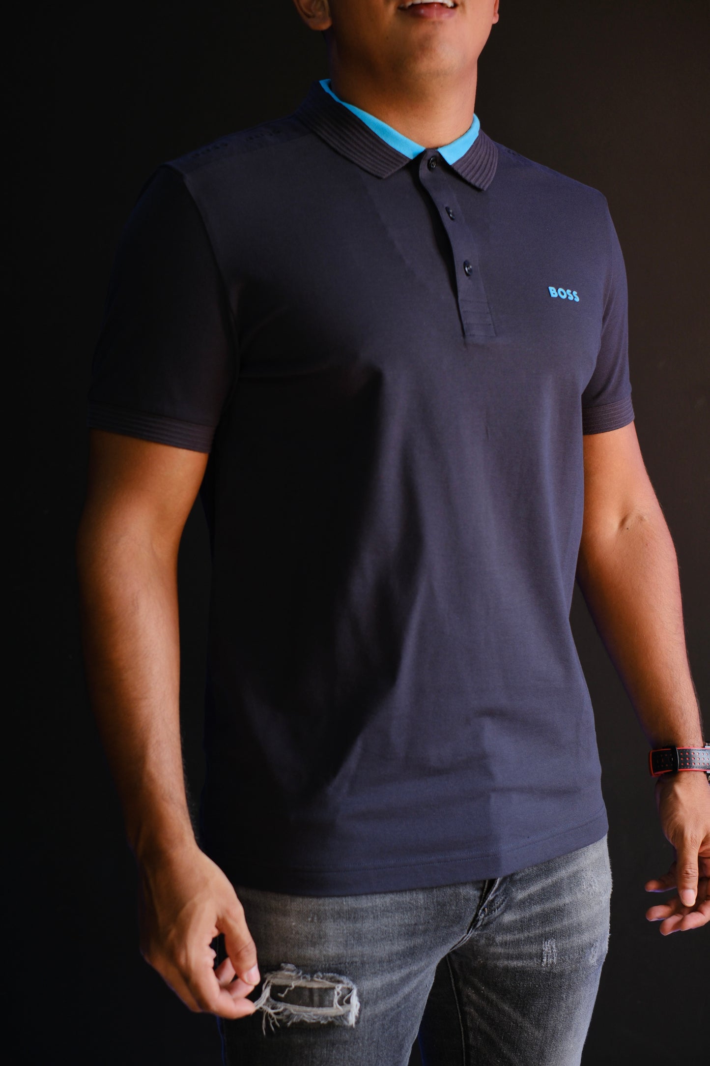 Polo HUG azul oscuro rayas