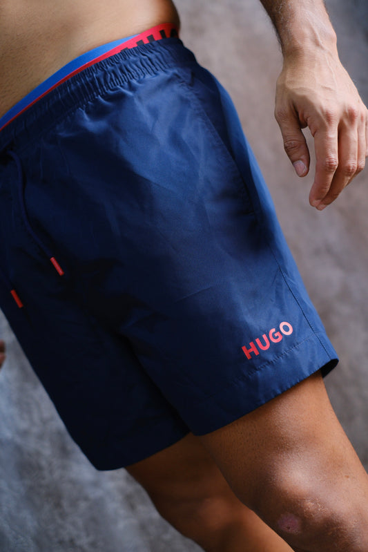 Pantaloneta HUG Azul Logo Rojo